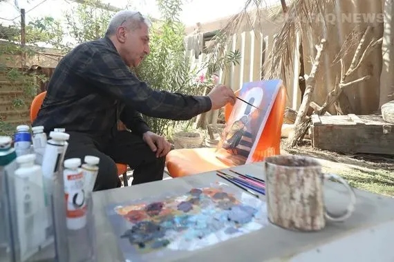 فنان بابلي يزرع الجمال على جدران مدينته ويوزع أعماله مجاناً صور شفق نيوز