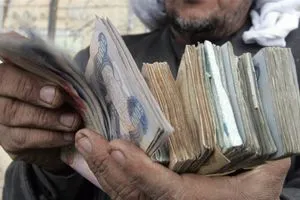 لماذا يرفض البنك المركزي العراقي خفض قيمة الدينار المرسومي يجيب بـ13 نقطة